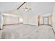 Open-concept living space features vaulted ceilings, neutral walls, and seamlessly connects multiple rooms at 40 Clear Spring Ln, Trafalgar, IN 46181