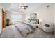 Bright main bedroom features a ceiling fan, tray ceiling, and large window at 40 Clear Spring Ln, Trafalgar, IN 46181
