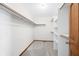 Walk-in closet features wall mounted shelving and carpeted floor at 40 Clear Spring Ln, Trafalgar, IN 46181