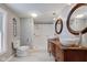 Bright bathroom featuring a dual sink vanity and walk-in shower at 42 E Brookville Rd, Fountaintown, IN 46130