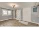 Bedroom with neutral paint, tile floors, multiple windows and a closet at 42 E Brookville Rd, Fountaintown, IN 46130