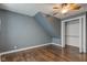 Bedroom featuring wood floors, neutral paint and a closet with shelving at 42 E Brookville Rd, Fountaintown, IN 46130