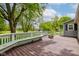 View of the wooden deck with white railings overlooking the backyard, providing a perfect outdoor space at 42 E Brookville Rd, Fountaintown, IN 46130