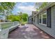 Spacious backyard deck with white railing and a bench, perfect for outdoor entertaining and relaxing at 42 E Brookville Rd, Fountaintown, IN 46130