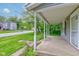 View from the porch showcasing the street and the architectural details of the home at 42 E Brookville Rd, Fountaintown, IN 46130