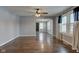 Open-concept living room with hardwood floors and neutral paint, flowing into other rooms at 42 E Brookville Rd, Fountaintown, IN 46130