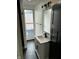 This bathroom features a single sink with dark wood floors and natural light for a bright modern feel at 44 S Butler Ave, Indianapolis, IN 46219