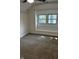 Bright bedroom with carpet and charming window seat overlooking the neighborhood at 44 S Butler Ave, Indianapolis, IN 46219
