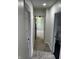 This carpeted hallway leads to multiple rooms with white walls and trim, creating a clean and bright transition at 44 S Butler Ave, Indianapolis, IN 46219