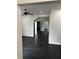 Bright, open living space with dark hardwood floors and a ceiling fan at 44 S Butler Ave, Indianapolis, IN 46219