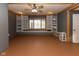 Spacious bonus room with custom built-in shelving, a large window, and neutral paint at 5077 Vantage Point Rd # 1 Wm-5-1, Avon, IN 46123