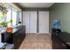 Dining area featuring a large window, dark sideboard, and tile flooring at 5077 Vantage Point Rd # 1 Wm-5-1, Avon, IN 46123