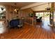 Dining room featuring wood floors, rustic light fixture, and wood paneling at 5077 Vantage Point Rd # 1 Wm-5-1, Avon, IN 46123