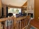 Stylish living room featuring a fireplace, wood paneled walls and sliding glass doors to the balcony at 5077 Vantage Point Rd # 1 Wm-5-1, Avon, IN 46123