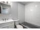 Bathroom featuring a vanity, toilet, and a tub with subway tile at 51 Glasgow Ln, Noblesville, IN 46060