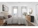 Inviting bedroom features neutral tones, large windows, and a decorative area rug at 525 Fynn Pl, Indianapolis, IN 46202