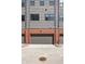 Attached garage with brick facade and modern gray siding, providing secure parking at 525 Fynn Pl, Indianapolis, IN 46202