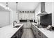 Spacious kitchen with black and white cabinets, stainless appliances, and a large island perfect for entertaining at 525 Fynn Pl, Indianapolis, IN 46202