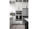 Well-appointed kitchen featuring a stainless steel appliance suite and white cabinets for a modern look at 525 Fynn Pl, Indianapolis, IN 46202