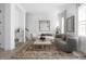Inviting living room with stylish furniture, a decorative rug, and large windows creating a cozy ambiance at 525 Fynn Pl, Indianapolis, IN 46202
