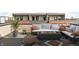 Relaxing rooftop patio with comfortable seating and a modern gas fire pit at 525 Fynn Pl, Indianapolis, IN 46202