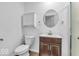 Bathroom featuring a toilet, vanity with storage, and a towel hanger at 5256 Bramwell Ln, Whitestown, IN 46075