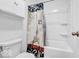 Bright bathroom features a shower with an Eiffel Tower design curtain and white cabinetry at 5256 Bramwell Ln, Whitestown, IN 46075