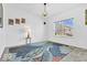 Bright bedroom with a large window and unique turtle-themed rug at 5256 Bramwell Ln, Whitestown, IN 46075
