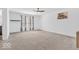 Expansive primary bedroom featuring neutral carpet, ample natural light, and ceiling fan at 5256 Bramwell Ln, Whitestown, IN 46075