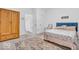 Bedroom with wardrobe, comfortable bed, and lots of sunlight coming from the window at 5256 Bramwell Ln, Whitestown, IN 46075