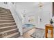 Welcoming entryway showcasing a staircase and elegant decor at 5256 Bramwell Ln, Whitestown, IN 46075