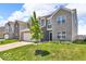Beautiful two-story home with gray siding and a lush green lawn at 5256 Bramwell Ln, Whitestown, IN 46075