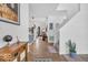 Inviting foyer with hardwood floors, white walls, and staircase at 5256 Bramwell Ln, Whitestown, IN 46075