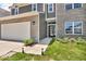 Lovely two-story house with a two-car garage and manicured landscaping at 5256 Bramwell Ln, Whitestown, IN 46075