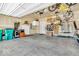 Spacious garage featuring overhead storage, appliances, shelving, and ample room for parking at 5256 Bramwell Ln, Whitestown, IN 46075
