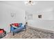 Upstairs hallway offers additional living space with cozy seating area and neutral decor at 5256 Bramwell Ln, Whitestown, IN 46075