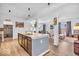 Open-concept kitchen with a center island and modern appliances at 5256 Bramwell Ln, Whitestown, IN 46075