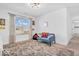 Well-lit living room with a large window, decorative curtains, and comfortable seating at 5256 Bramwell Ln, Whitestown, IN 46075