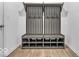 Mudroom with a gray wooden storage bench, hooks for hanging items, and cubbies for shoes and accessories at 5256 Bramwell Ln, Whitestown, IN 46075