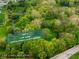 Aerial view of a 5.18 acre lot showcasing the home's position amongst mature trees and greenery at 5356 S U.S. Highway 421, Zionsville, IN 46077