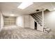 Basement featuring carpet, stairs, and white walls at 5356 S U.S. Highway 421, Zionsville, IN 46077