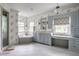 Bright bathroom featuring a soaking tub, separate shower, and vanity with abundant storage and a makeup area at 5356 S U.S. Highway 421, Zionsville, IN 46077