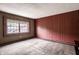 Bedroom with a window, carpet, and vertically-striped wallpaper at 5356 S U.S. Highway 421, Zionsville, IN 46077