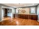 Spacious dining room features hardwood floors, detailed built-ins, and a decorative tile mural at 5356 S U.S. Highway 421, Zionsville, IN 46077