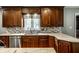 Kitchen with granite countertops, stainless steel appliances, and ample dark wood cabinetry at 5356 S U.S. Highway 421, Zionsville, IN 46077