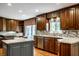 Updated kitchen featuring custom cabinets, stainless steel appliances, and granite countertops at 5356 S U.S. Highway 421, Zionsville, IN 46077
