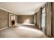 Large living room with textured walls and French doors offers lots of natural light at 5356 S U.S. Highway 421, Zionsville, IN 46077