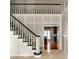 Elegant staircase with black handrail leads to the second floor and offers an open view at 5356 S U.S. Highway 421, Zionsville, IN 46077