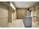 Large walk-in closet featuring shelving and a center island with drawers for optimal organization at 5356 S U.S. Highway 421, Zionsville, IN 46077