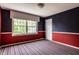 Bedroom with wallpaper, striped carpet, and a window offering ample natural light and outside views at 5356 S Us421, Zionsville, IN 46077